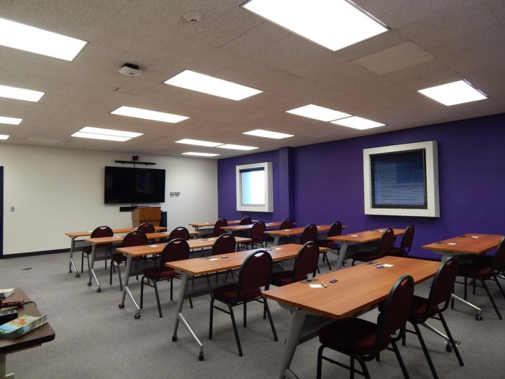 Overview photo of conference room with chairs and tables