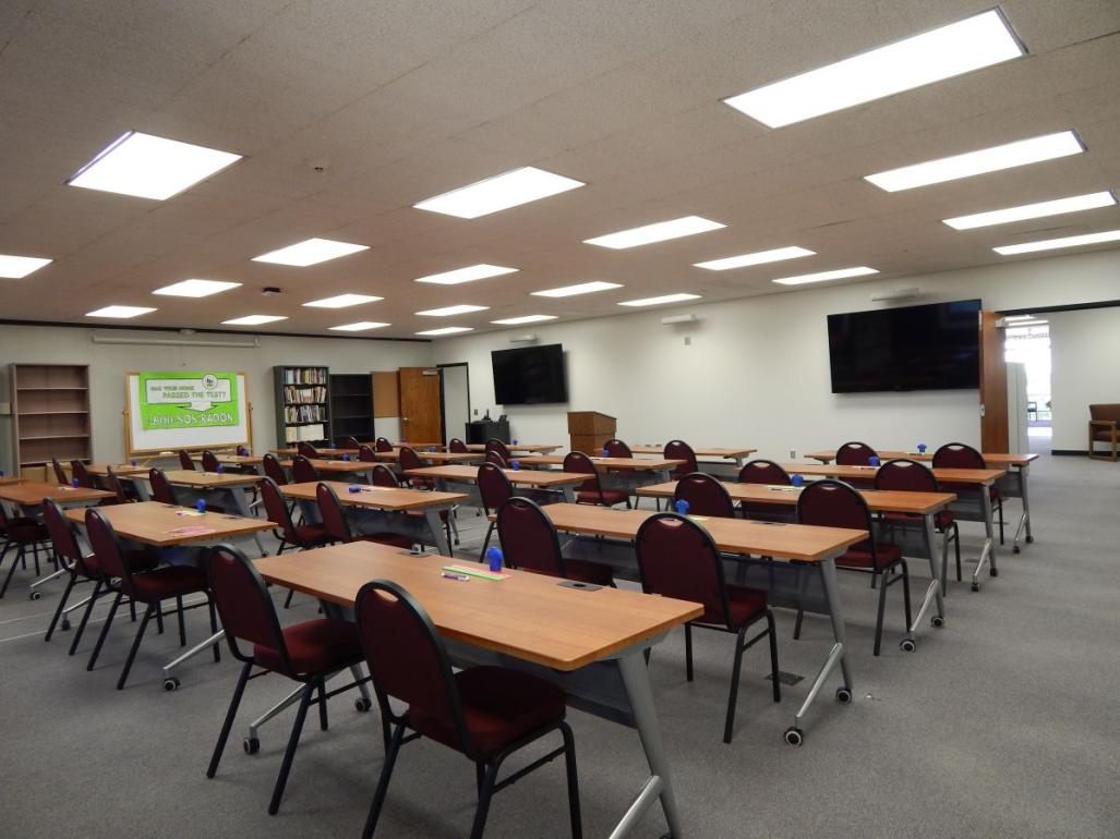View of large training room with tables and chairs