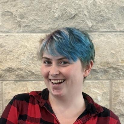 Brie in front of limestone wall 2025